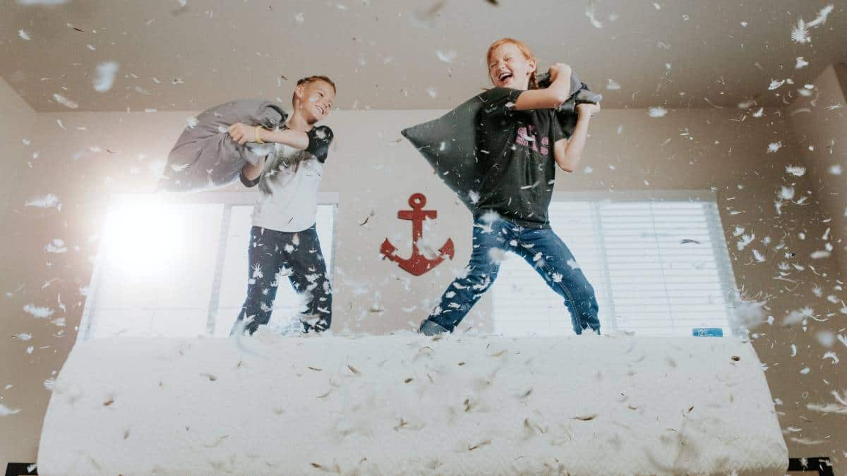 kids playing pillow fight