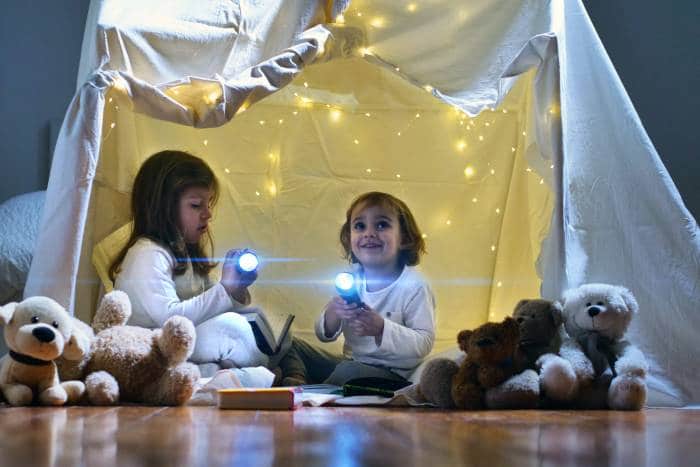 little girls inside indoor tent with lights