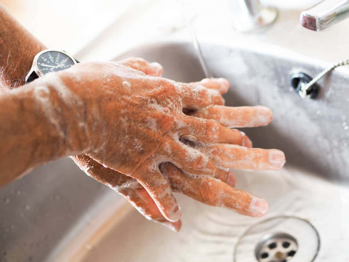 man washing his hands thoroughly