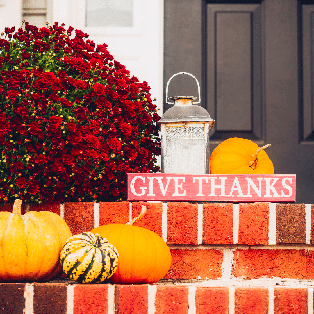 a porch with a Halloween and Thanksgiving theme