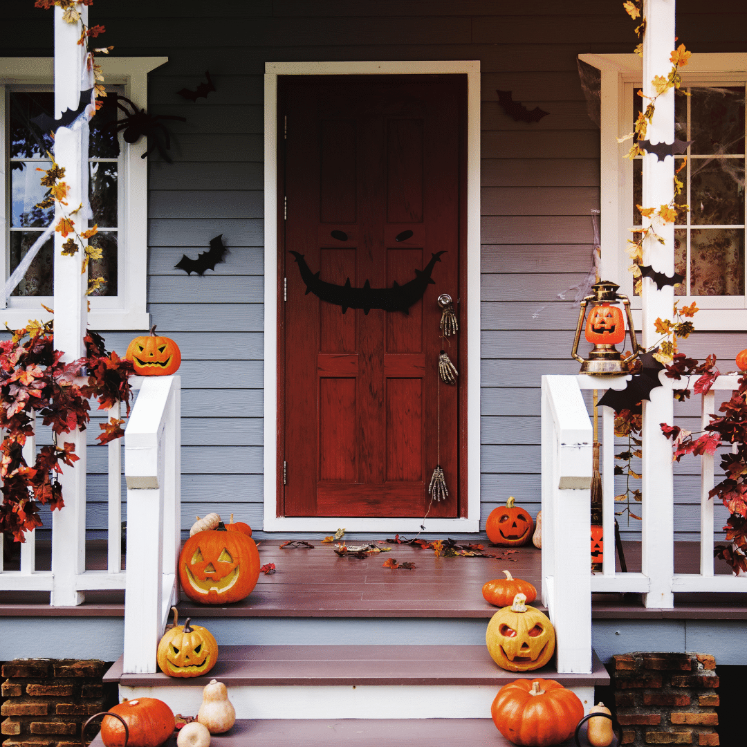 Home entryway with pumpkins and fake bats
