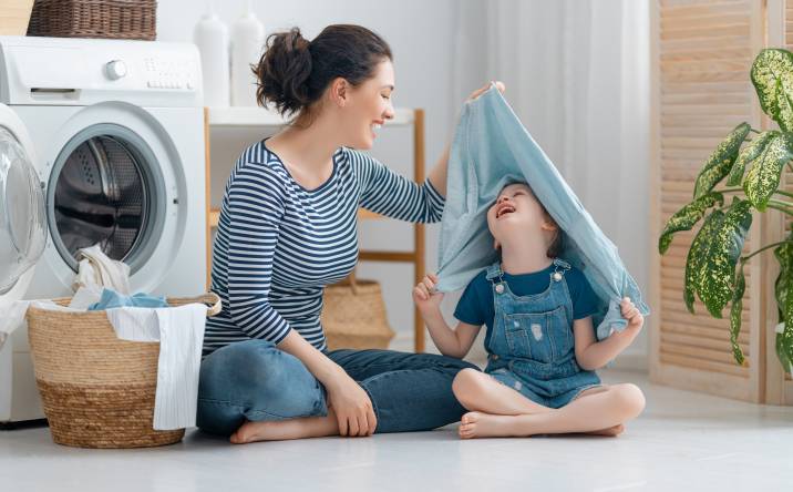 mum doing laundry with her kids