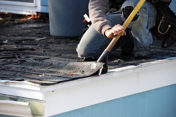 removing a flood-damaged roof tile