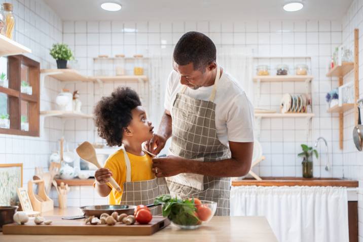 father and son preparing a breakfast