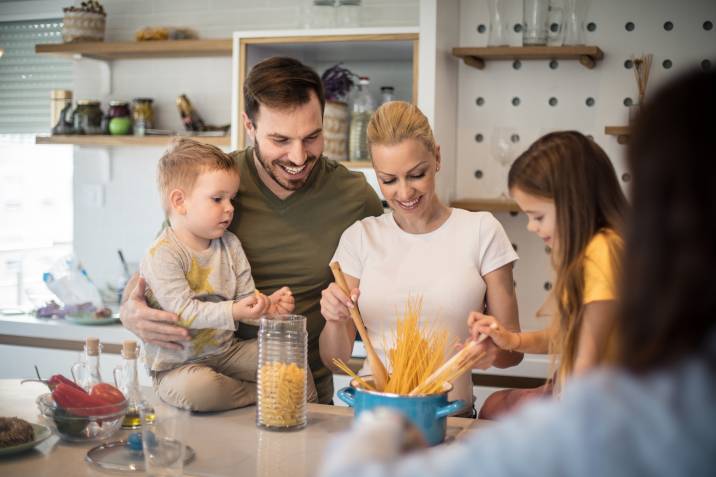 a family preparing a meal together