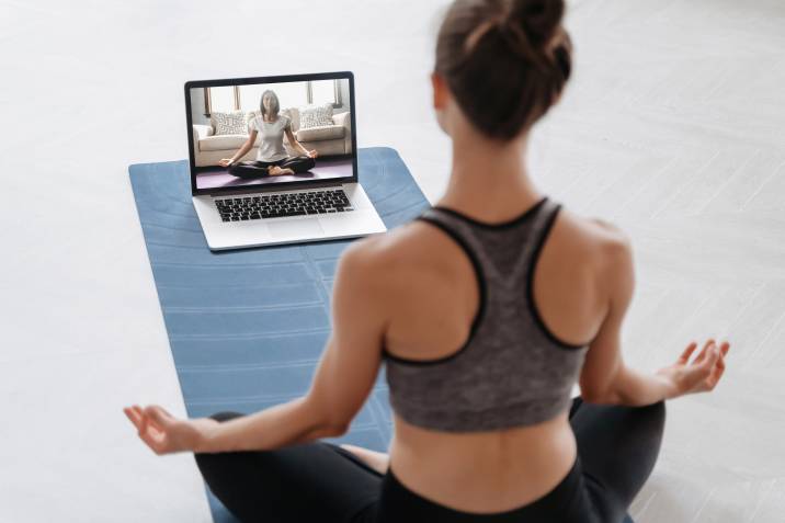 mom conducting yoga class online as a side hustle
