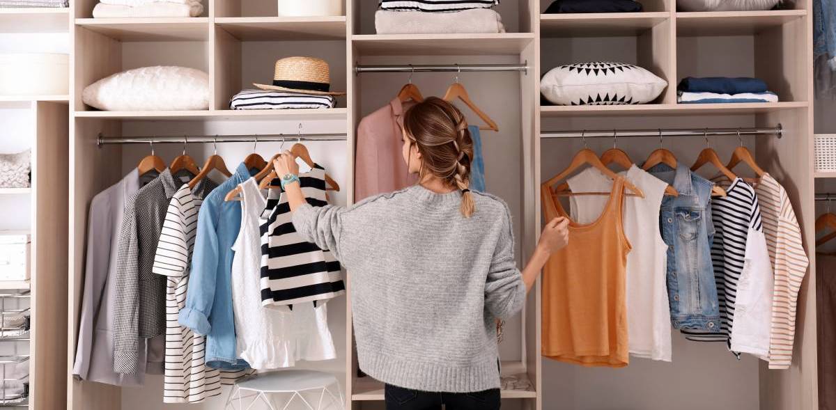 stay-at-home mom organising wardrobe as a side hustle