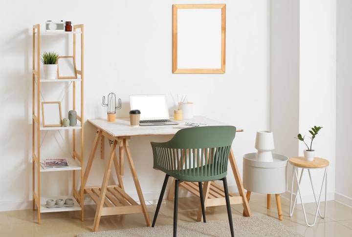 a neat office desk with a neutral green office chair