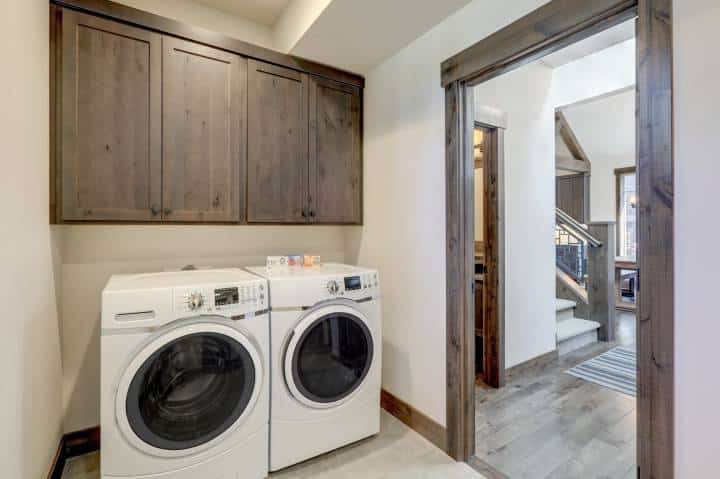 laundry room with compact cabinets