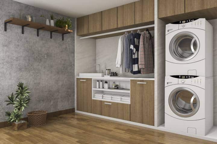 laundry room with concrete walls and wood grain flooring