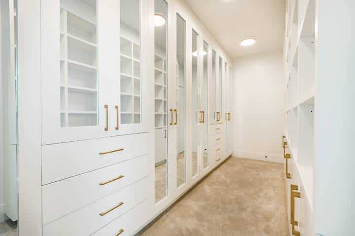 closet space with gold drawer handles