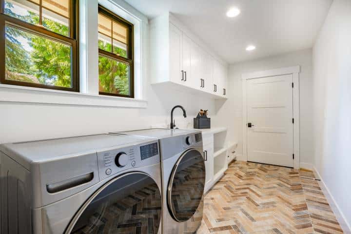 laundry room with herringbone flooring