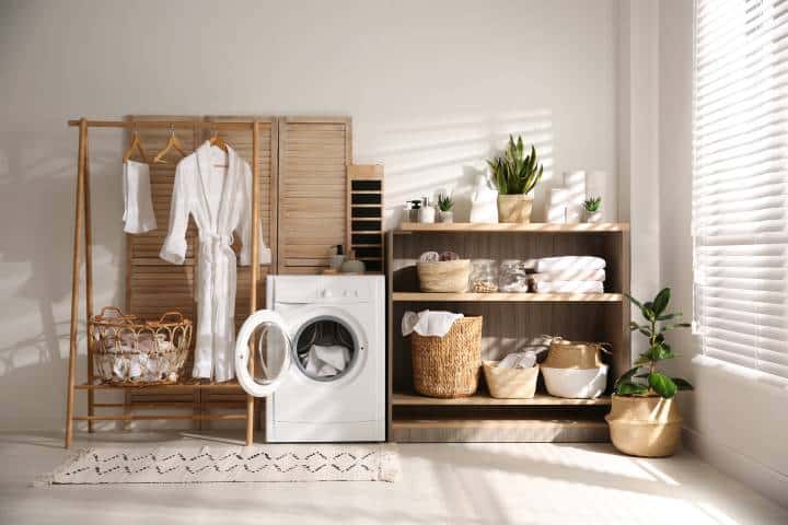 laundry room with light wood and greenery interiors