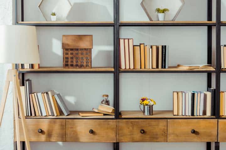 wooden book shelf with bottom drawers