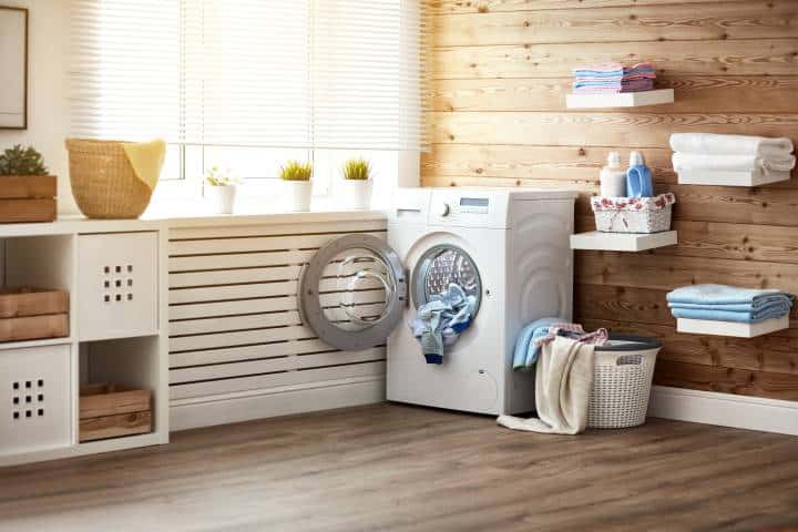 laundry area with timber walls and flooring