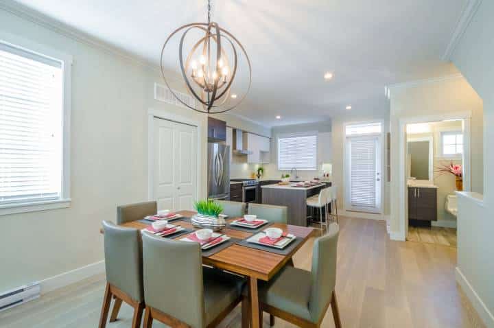 Modern dining room in luxury house with double orbit overhead lighting