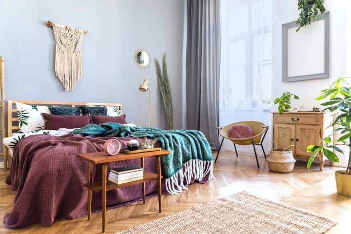 Stylish and luxury interior of bedroom with maroon and emerald colours 