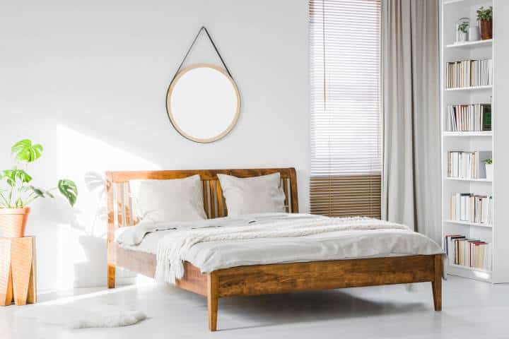 simple bedroom with wooden bed frame details