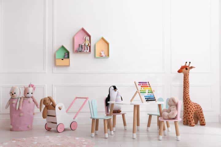 Cute child's playroom with toys and modern furniture