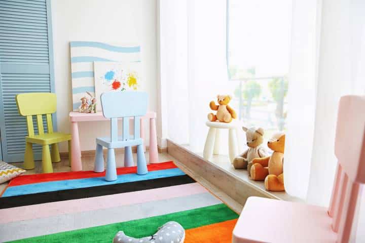 Interior of playing room with colourful rug