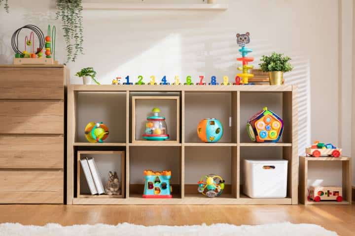 Nursery room with colorful toys in wooden box