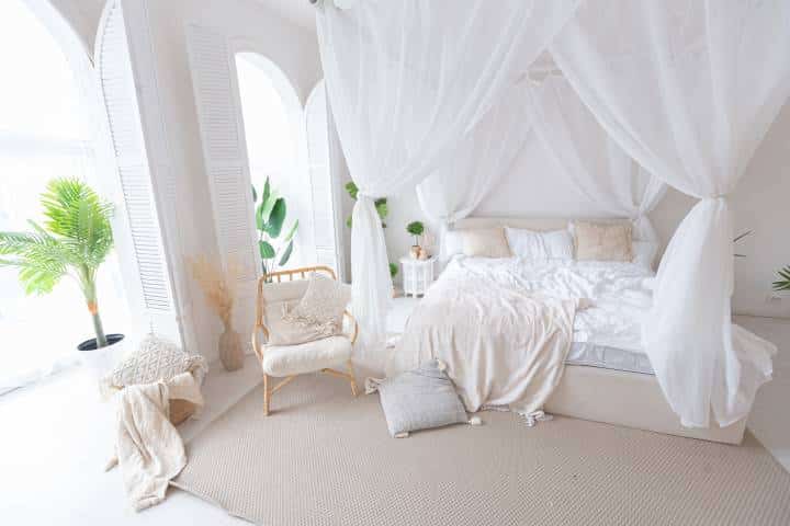 Cozy interior of a bright bedroom with white walls