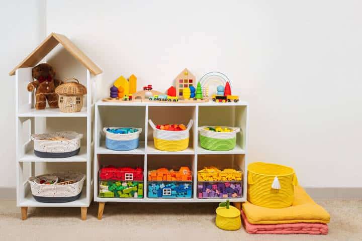 White shelving with colorful storage baskets