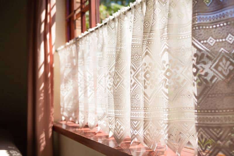 backlit flower-patterned crochet curtain