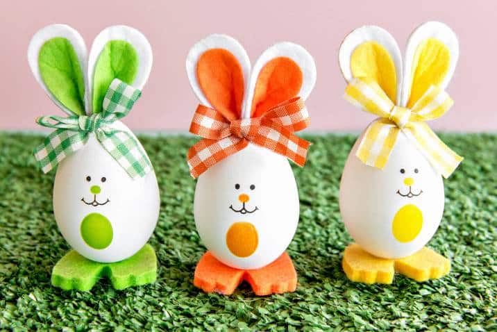 Easter egg bunnies on grass background
