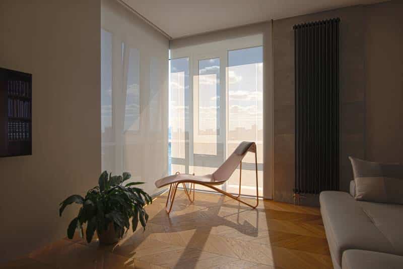 Motorised roller blinds in the living room, large automatic solar shades on the windows. Modern interior with a relax chair by the window