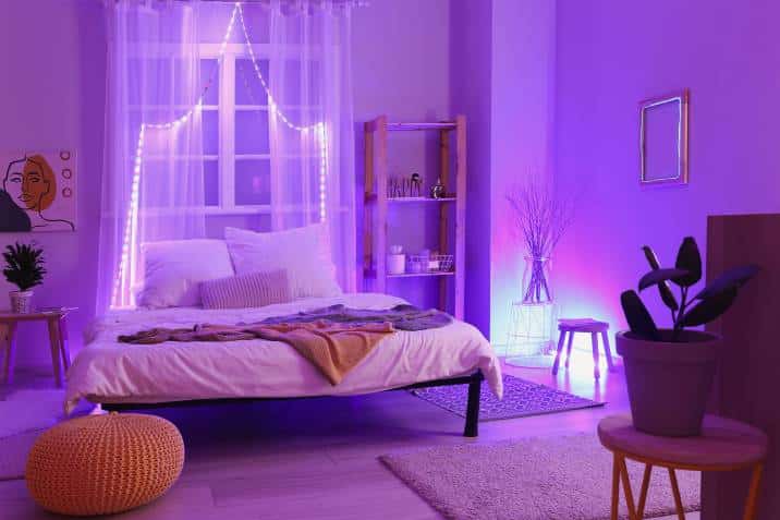 stylish bedroom with pink purple neon lighting