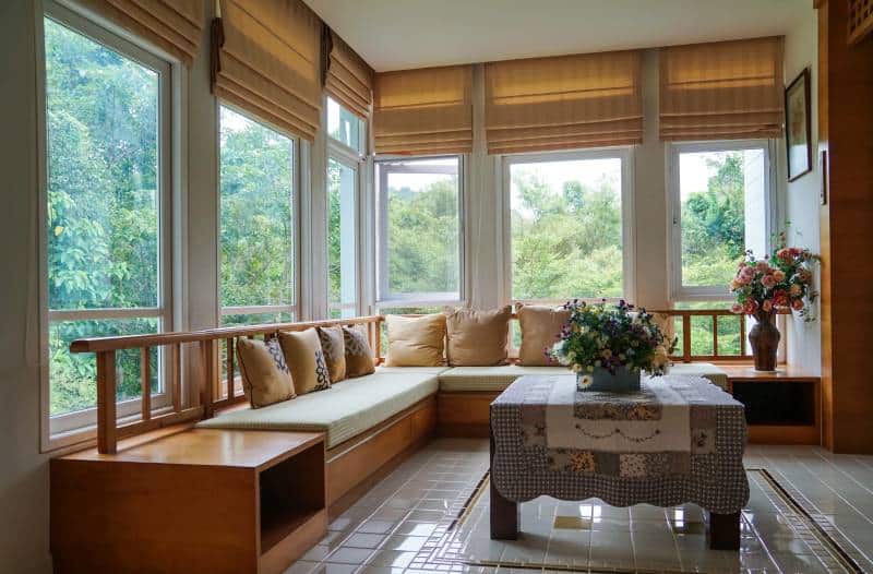 brown roman blind shade curtains, forest mountain window view in living room