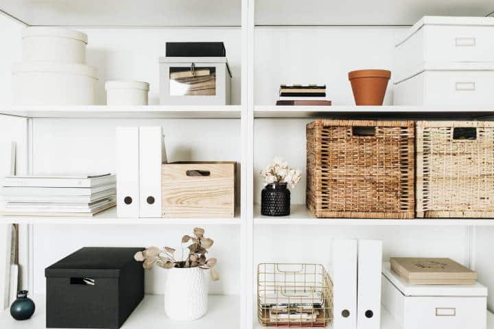 White storage shelves rack with woven boxes