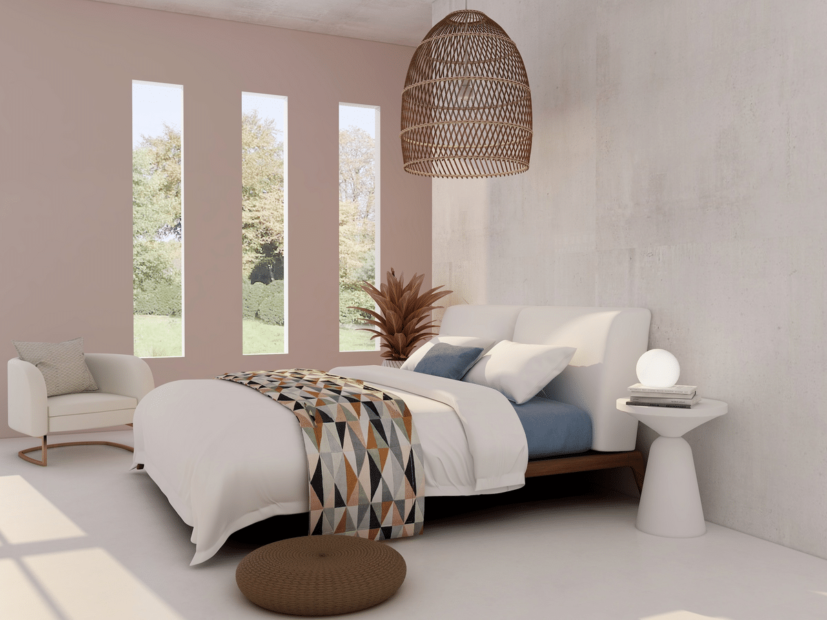 bedroom with three tall windows, bed with blue and white pillows, and a big rattan pendant light overhead