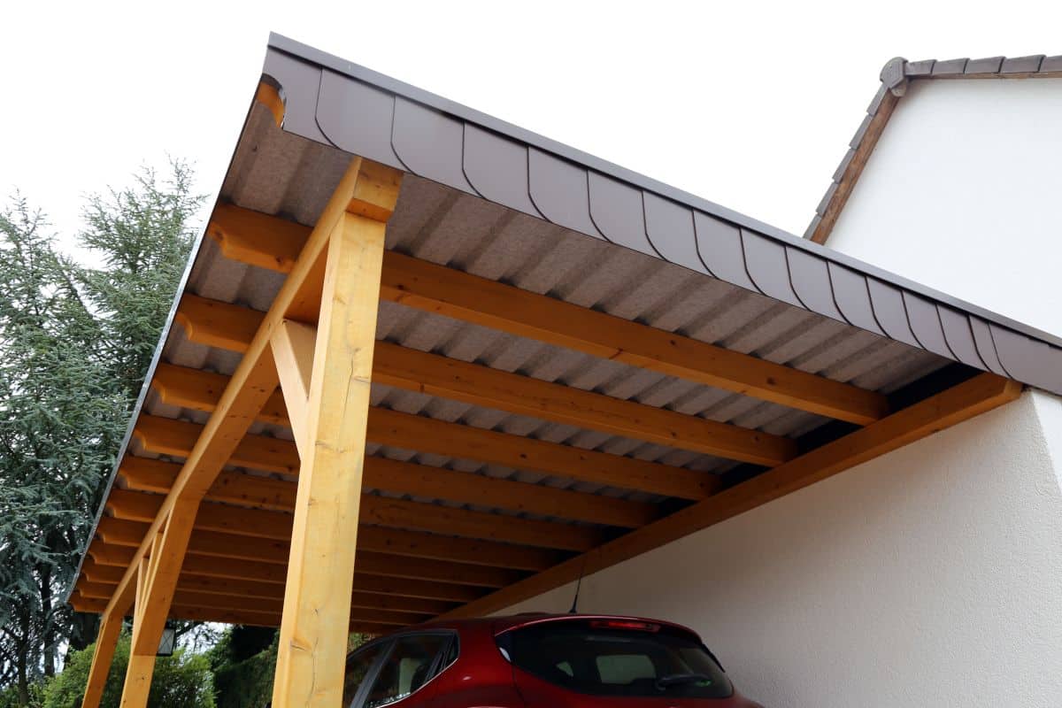 wooden carport with shingle roof