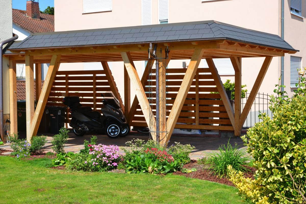 wooden carport with tiled roof and copper rain gutter