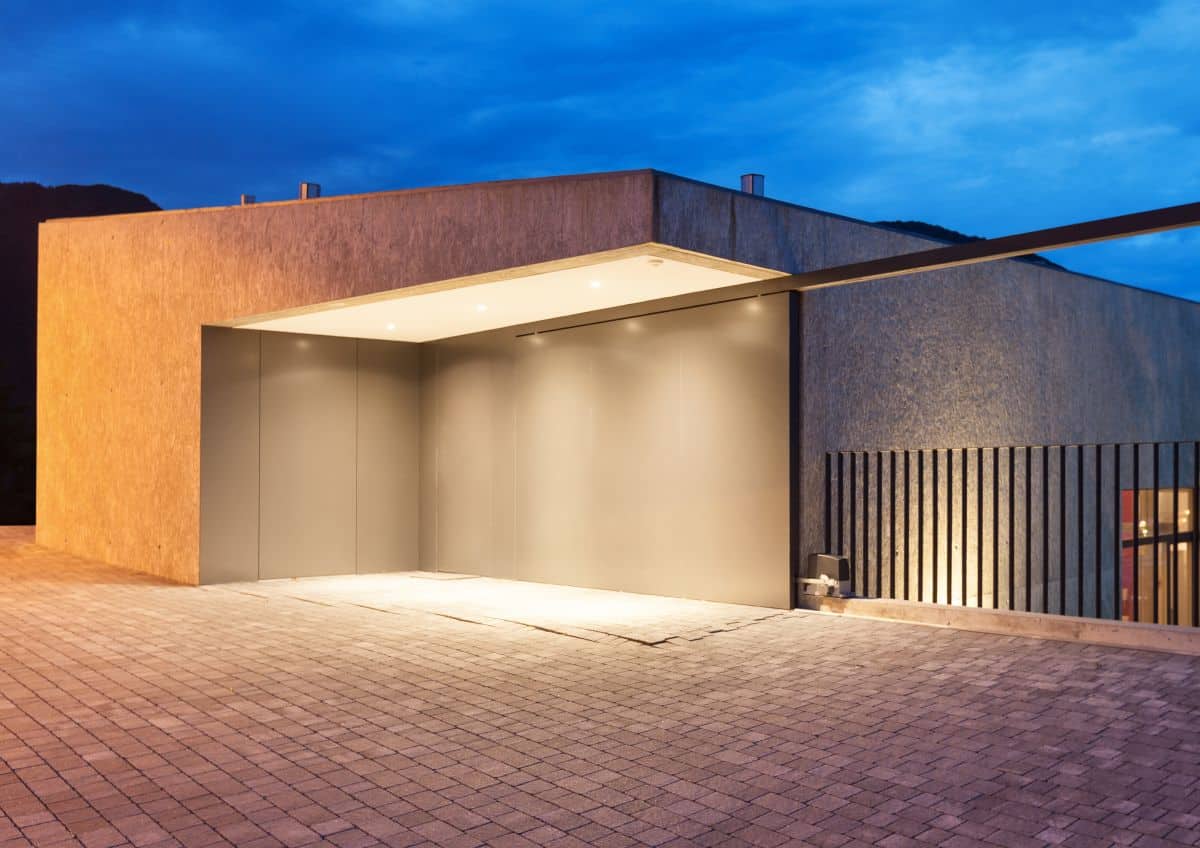 modern carport with flush mount light at night