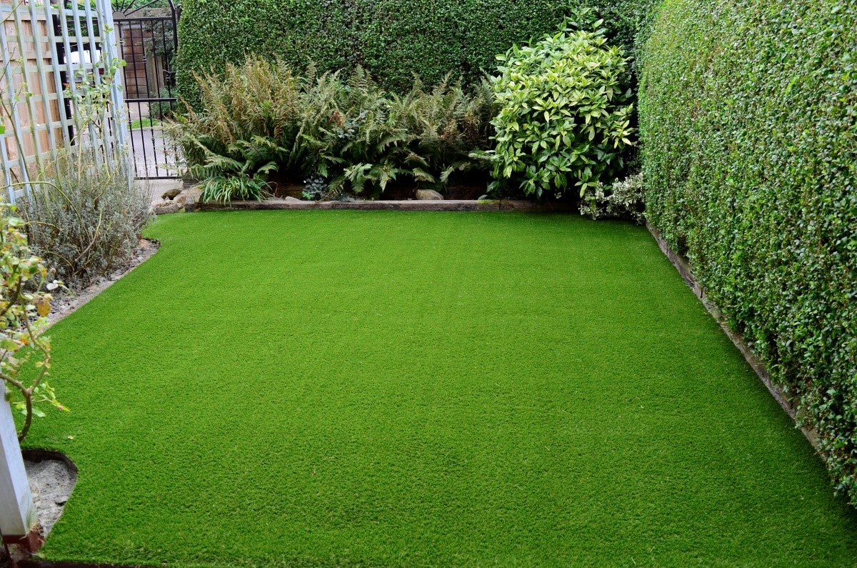 Newly laid artificial lawn in small front garden