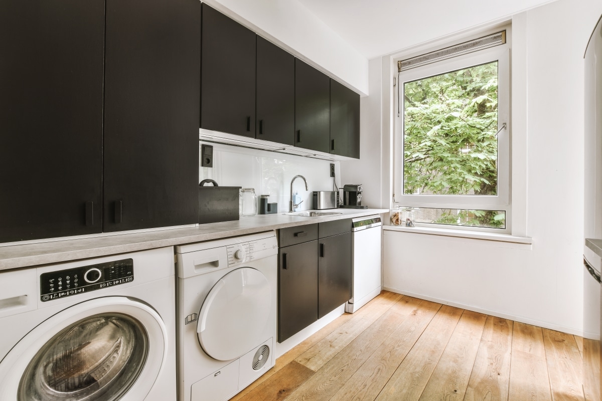 laundry interior with black cabinets