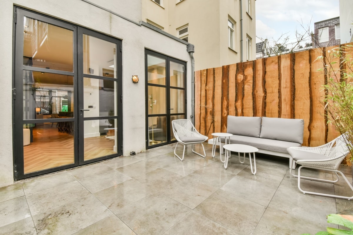 backyard with a seating area on a marble floor