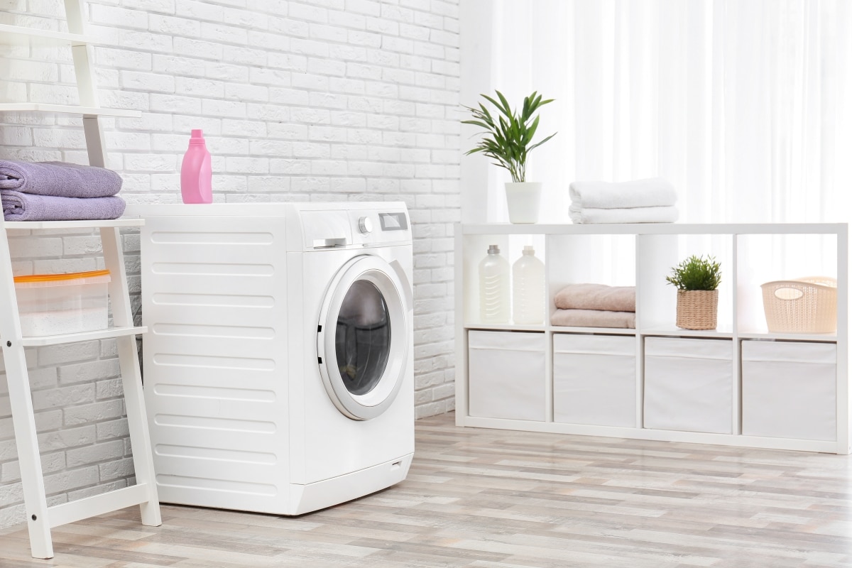 washing machine with white brick wall 