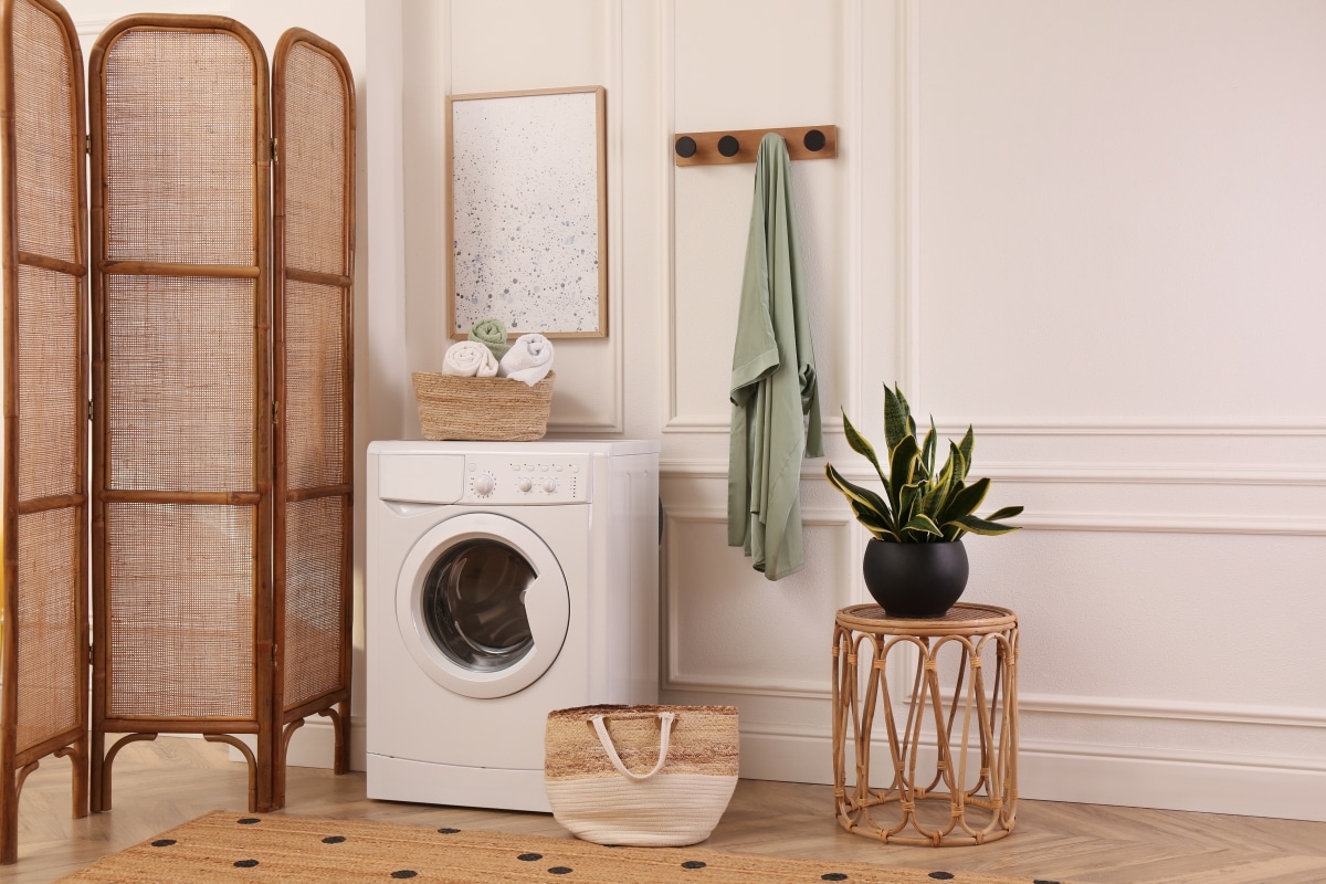 laundry room interior with washing machine and beautiful wooden divider