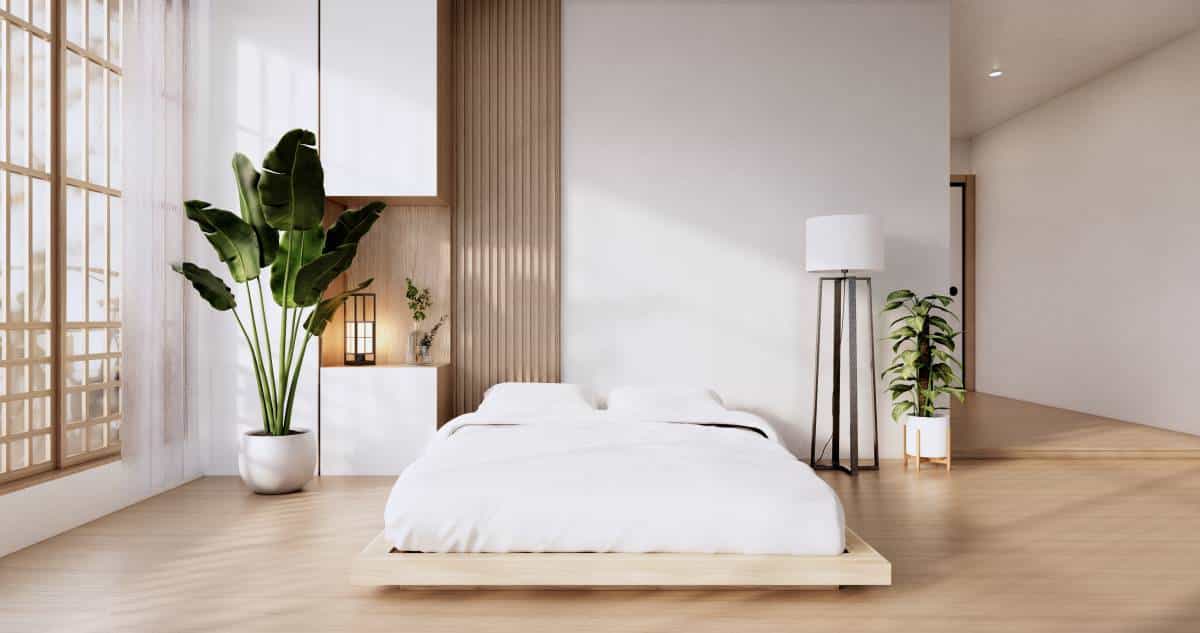 Bedroom in japanese minimalist style with white modern wall