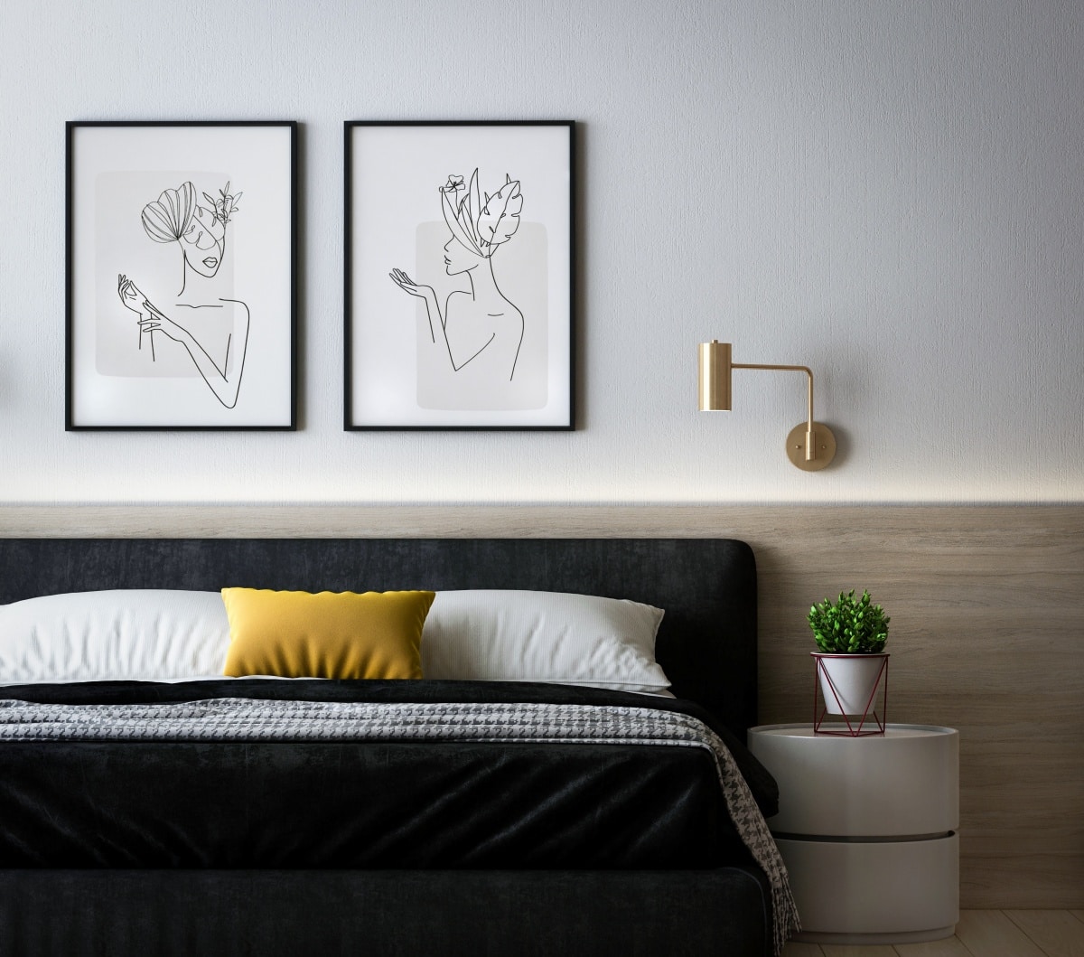 Black, white, and yellow bedroom with line art on wall