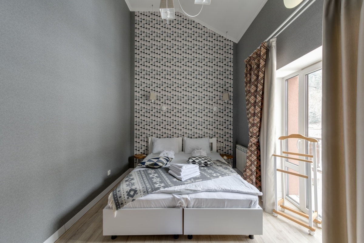 Grey and white painted bedroom with double bed