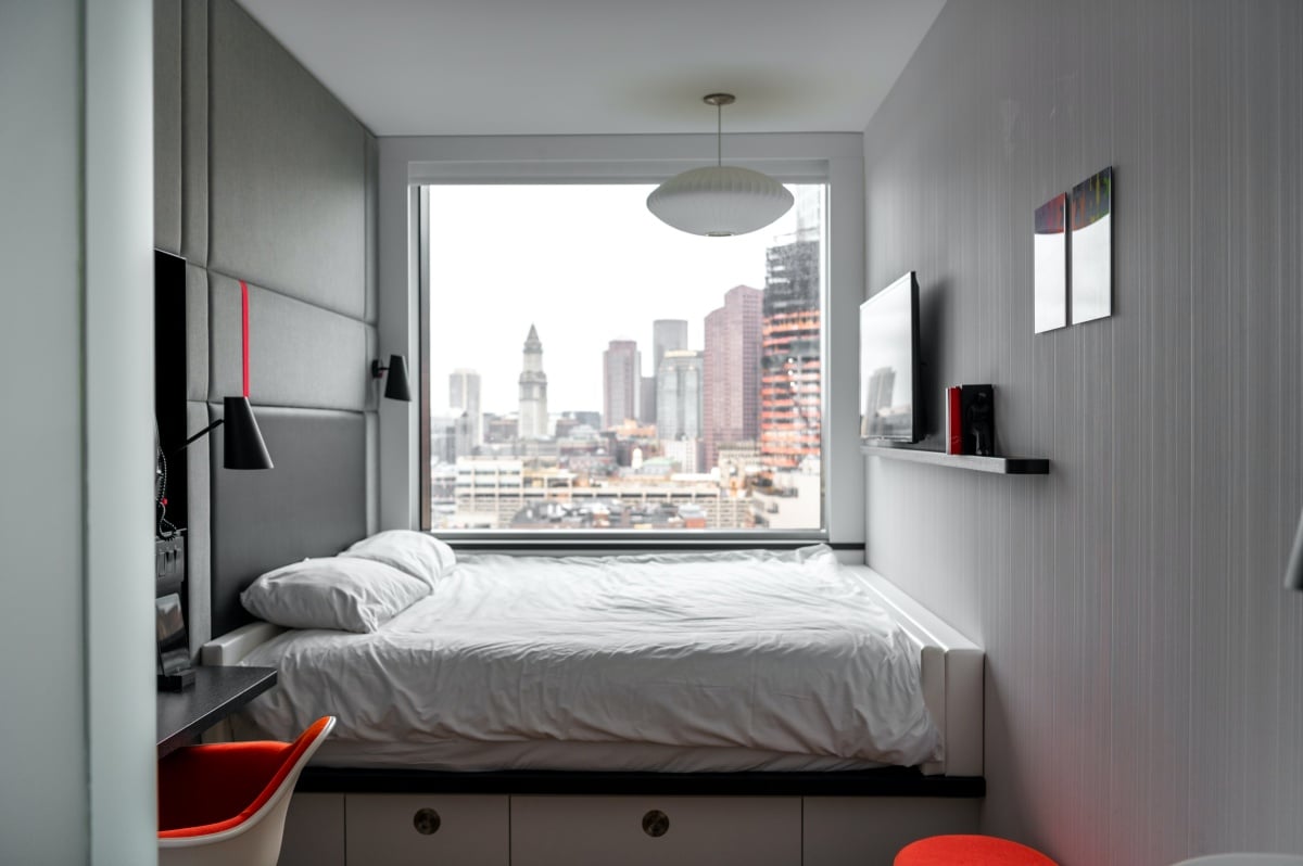bedroom interior overlooking a city skyline