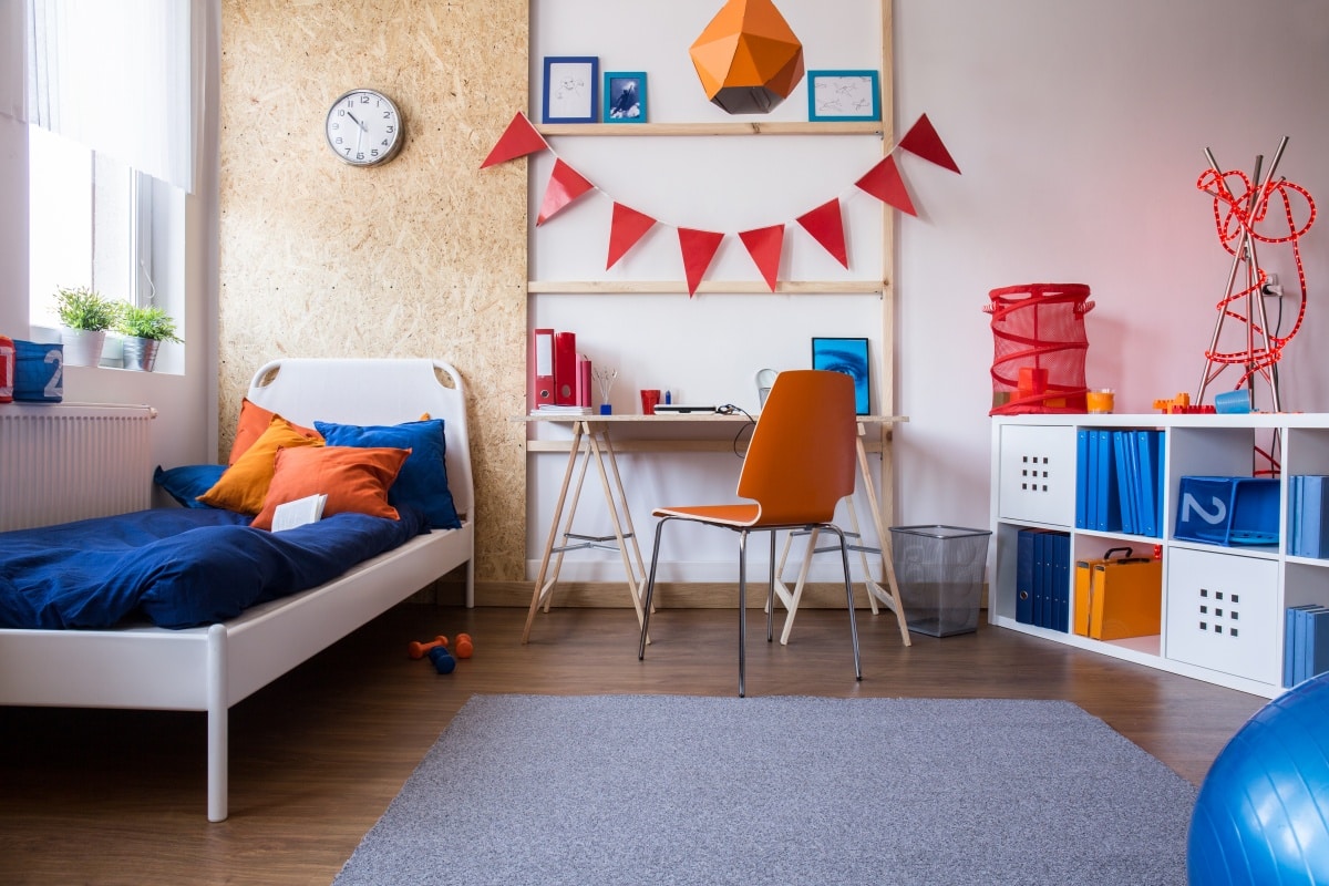 Modern teen boy bedroom on colours red, blue, and orange