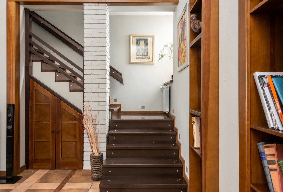 Cabinet built under wood staircase