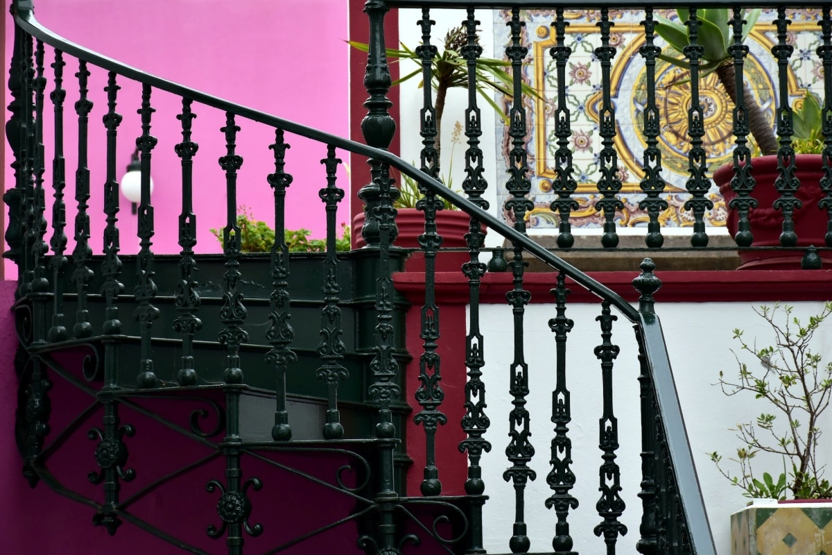 A curved cast iron staircase