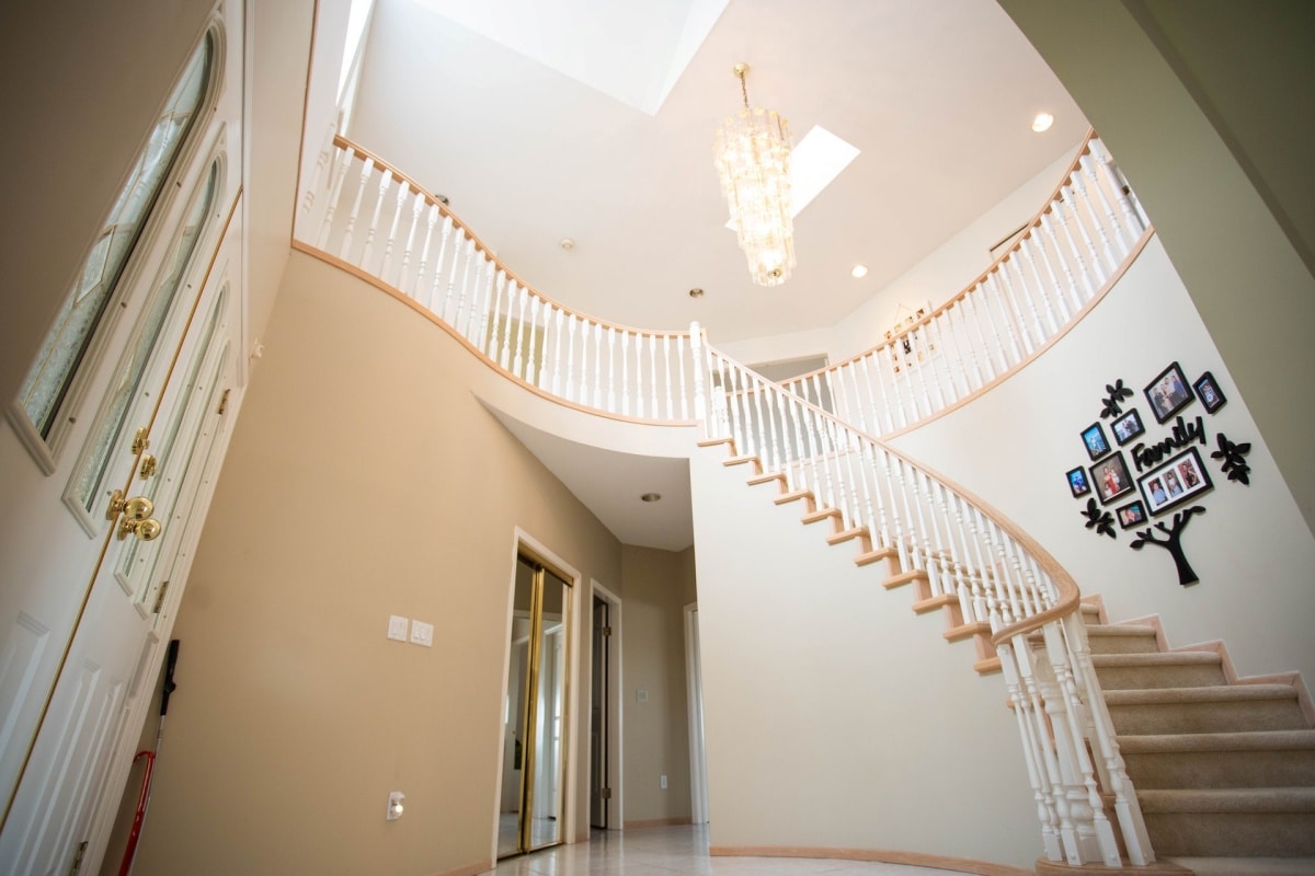 home staircase with a gallery wall